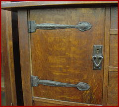 Additional image of the door on the left side showing the hand hammered copper strap hinges and door pull.